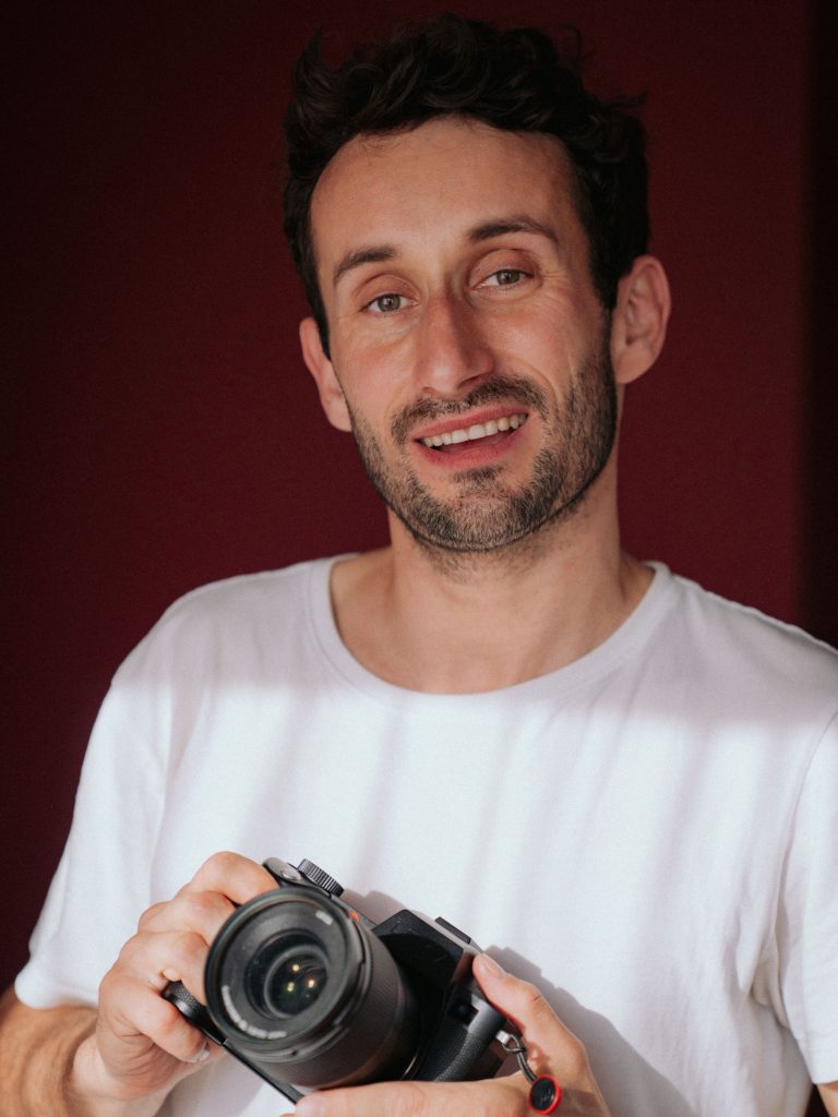 Photographer holding Leica in hands